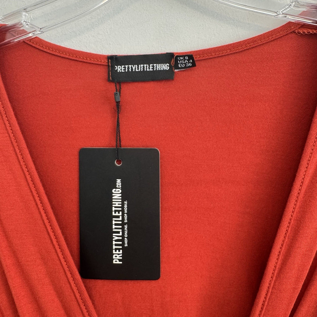 PrettyLittleThing Burnt Orange O-Ring Bodysuit Flare Sleeve Cutout Size 4 NWT 