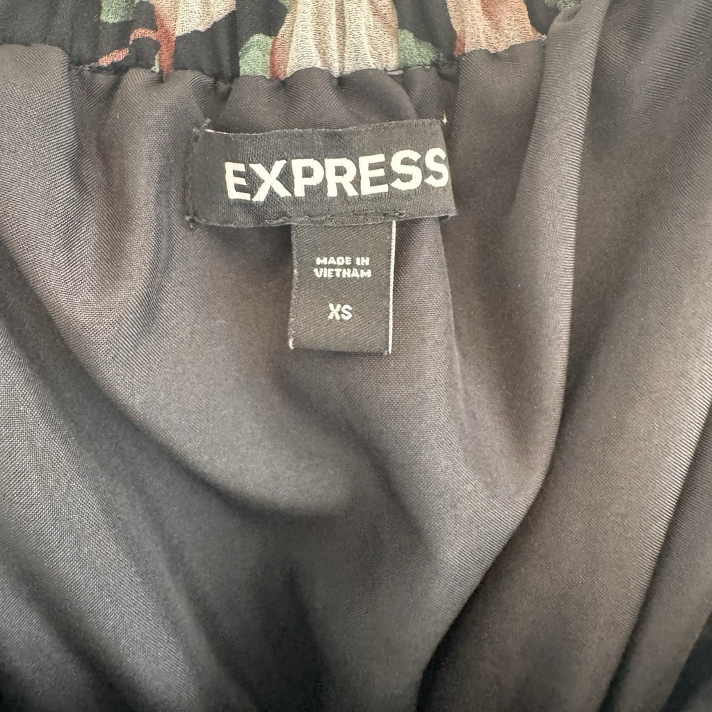 Express Black Floral Romper XS Calla Lily Print Ruffle Hem Strappy Back