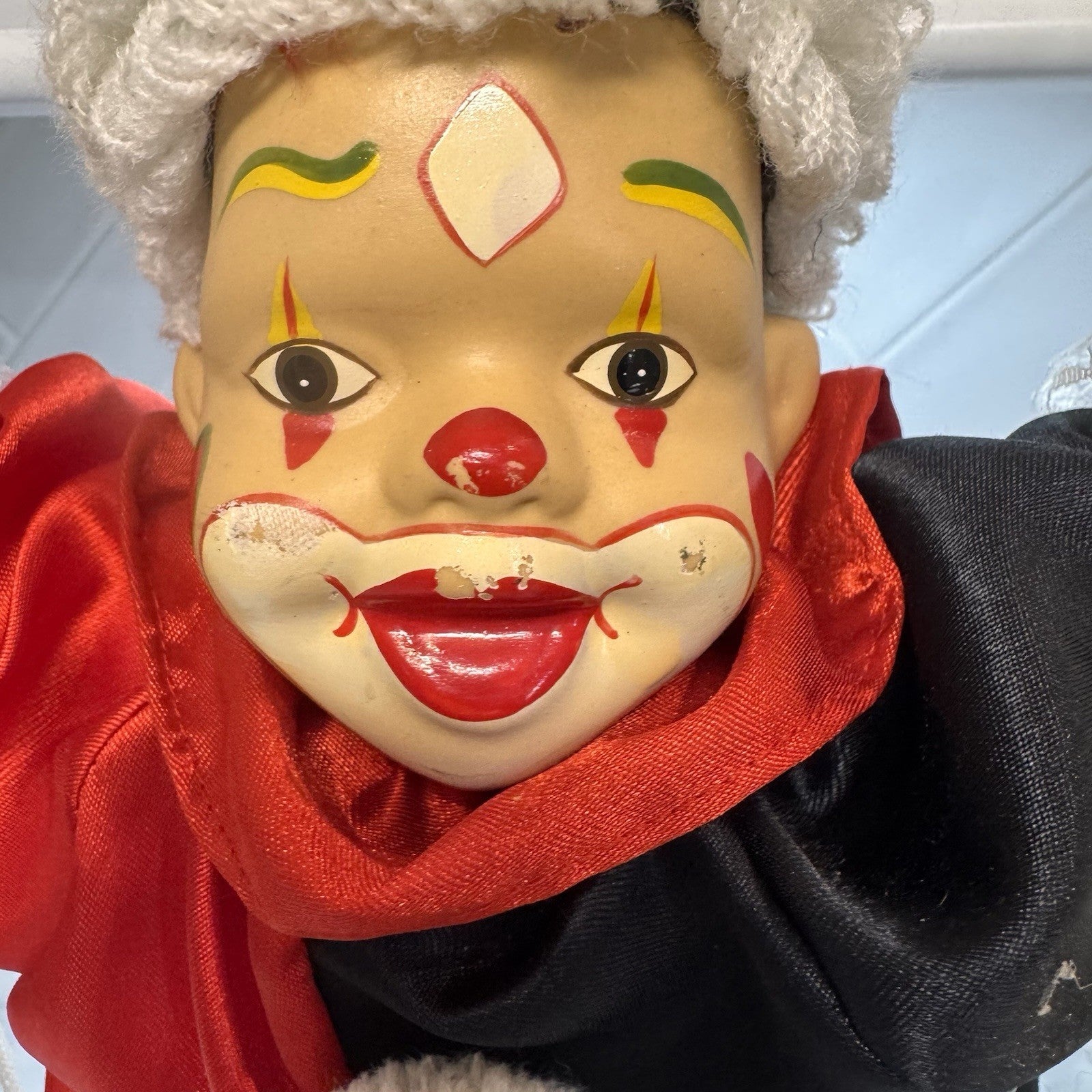 Vintage BVI Inc Porcelain Face Clown on Wooden Swing Red Black Harlequin Jester