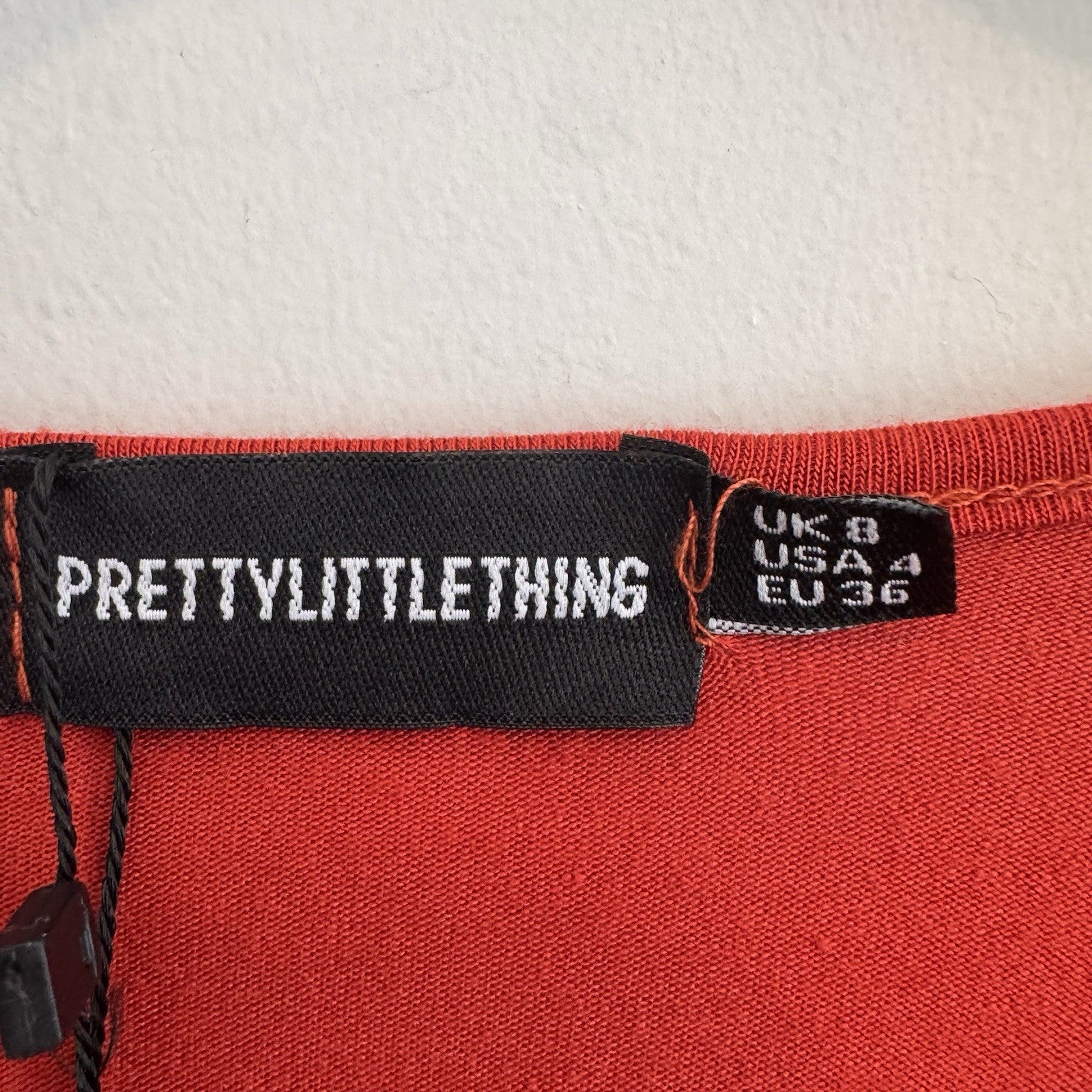PrettyLittleThing Burnt Orange O-Ring Bodysuit Flare Sleeve Cutout Size 4 NWT 